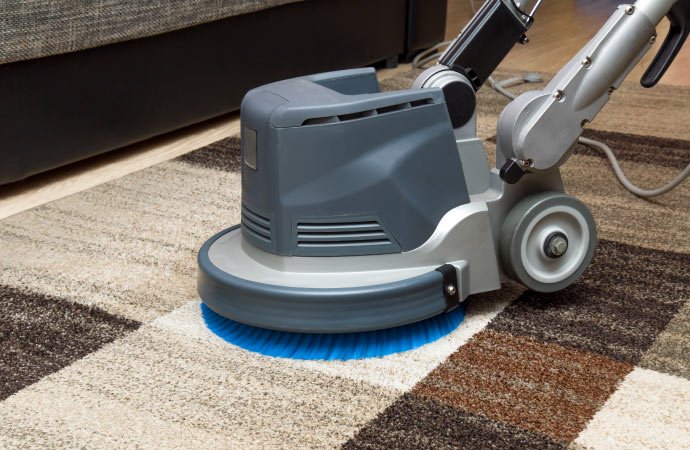 Rotary machine carpet cleaning in Udaipur – advanced deep cleaning for hotel and banquet carpets.