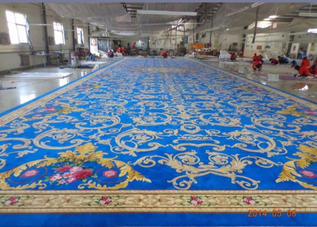 Large luxury blue carpet manufacturing in Ahmedabad – floral pattern custom rug for banquet halls and premium venues.